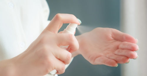 Stock photo woman hands using antiseptic spray covid pandemic coronavir protection from bacterias and 1685473972